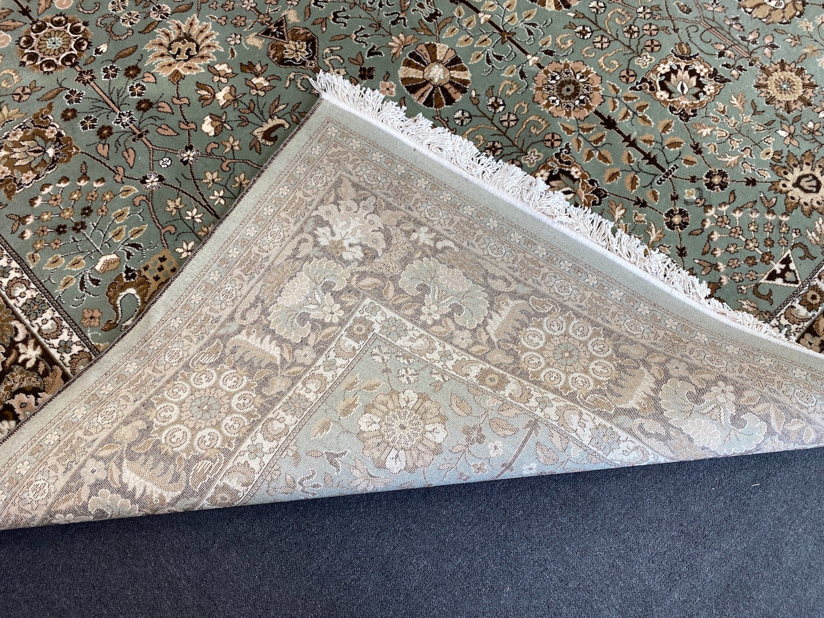 A Tabriz style green ground carpet, 400 x 300cm